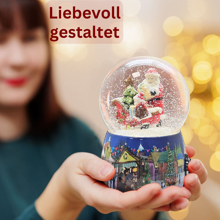 Nostalgie - Schneekugel mit Weihnachtsmann mit Schlitten mit Spieluhr 100 mm Durchmesser - Schneekugelhaus
