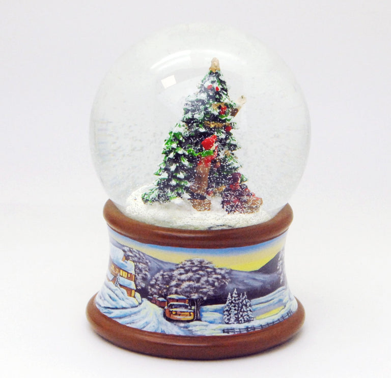 Schneekugel Weihnachtsbaum schmücken auf Sockel Winterlandschaft braun mit Spieluhr 10 cm Durchmesser - Schneekugelhaus