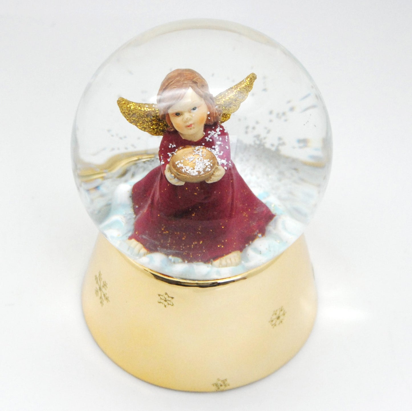 Schneekugel Engel rot mit Schale gold auf Sockel gold mit Sternen mit Spieluhr - Schneekugelhaus